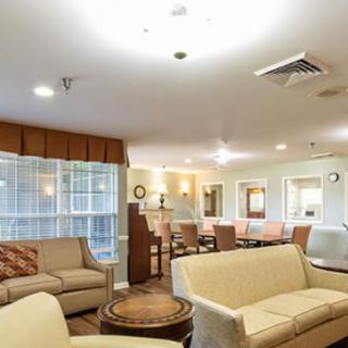 A cozy living room with comfortable sofas and warm lighting.