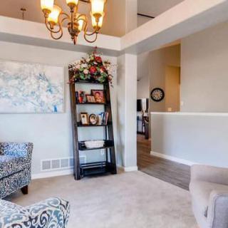 A cozy living room with elegant decor and comfortable seating.