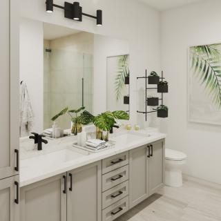A modern bathroom featuring a sleek vanity with dual sinks, decorative plants, and stylish lighting fixtures.