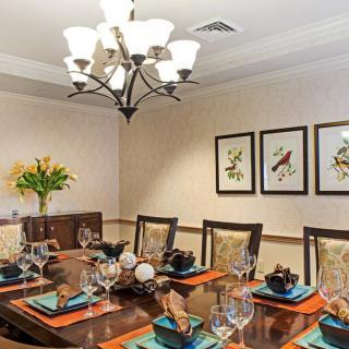 Elegant dining room with a beautifully set table and artistic decor.