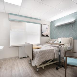 A modern and comfortable hospital patient room designed for recovery.