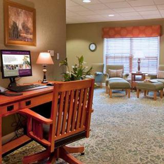 A cozy living space featuring a computer desk and a comfortable seating area.
