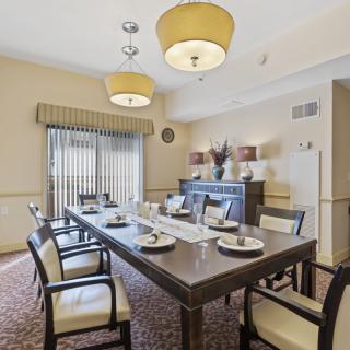 A well-arranged dining room with elegant furniture and decor.