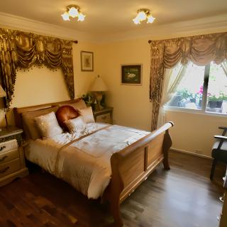 Elegant bedroom with classic decor and a cozy atmosphere.