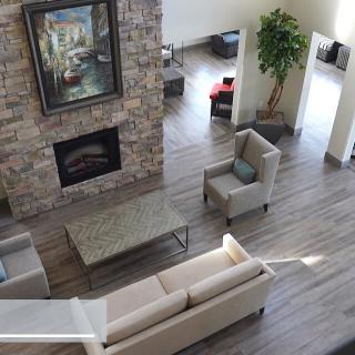 A modern living room with a cozy fireplace and stylish furniture.