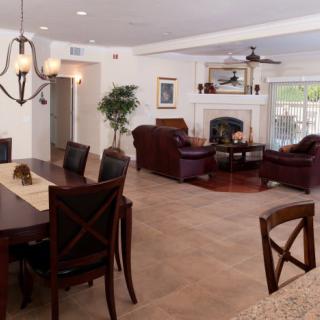 A spacious open-plan living and dining area with modern furniture and elegant decor.