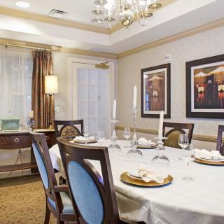 An elegant dining room with a well-set table and stylish decor.