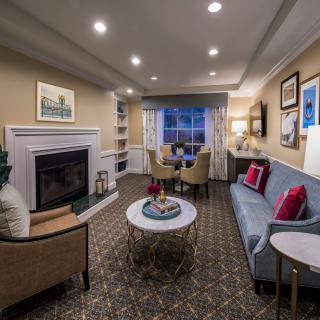 Cozy living room with modern decor and a fireplace.