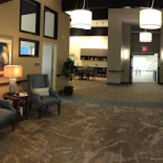 A modern lobby featuring comfortable seating, stylish lighting, and a welcoming atmosphere.