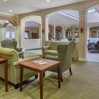 A cozy lobby interior with comfortable seating and elegant archways.