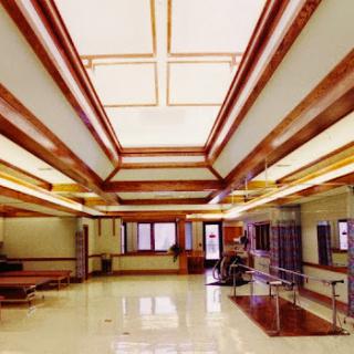A spacious and well-lit interior lobby showcasing modern architectural design.