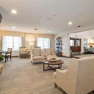 A modern living room with comfortable seating and bright natural light.
