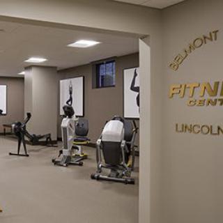 An indoor fitness center with various exercise equipment.