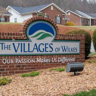 Entrance sign for The Villages of Wilkes residential community.