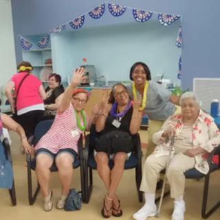 A joyful group of people enjoying a social gathering indoors.