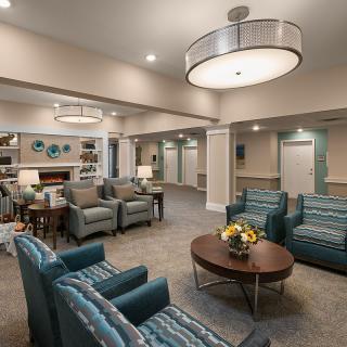 A modern lobby area featuring comfortable seating and elegant lighting.