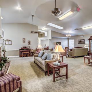 A spacious living room with comfortable furniture and warm decor.