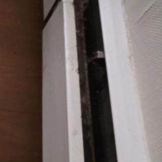A close-up view of a window with a noticeable gap in the seal.