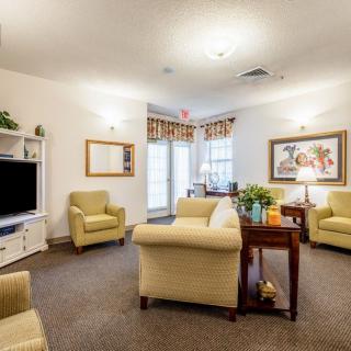A cozy living room with comfortable seating and a television.