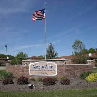 Entrance to a facility with the American flag prominently displayed.