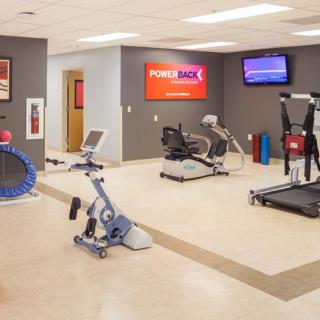 A well-equipped fitness and rehabilitation center with various exercise machines.