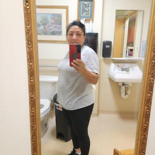A casual selfie taken in a bathroom mirror.
