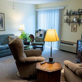 Cozy living room with comfortable seating and warm lighting.