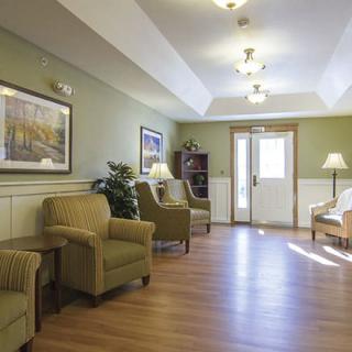 A well-lit lobby with comfortable seating and tasteful decor.