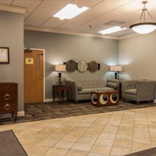 A cozy lobby area featuring comfortable seating and stylish decor.