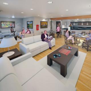 A stylish and modern living room featuring comfortable seating arrangements and art-filled walls.