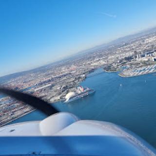 A stunning aerial view of the city and water from an airplane.