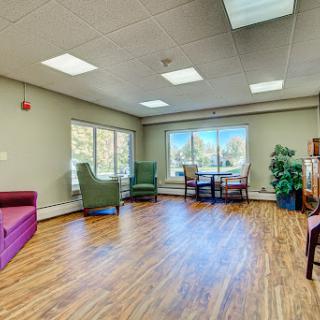 A cozy living space with ample natural light and comfortable seating.