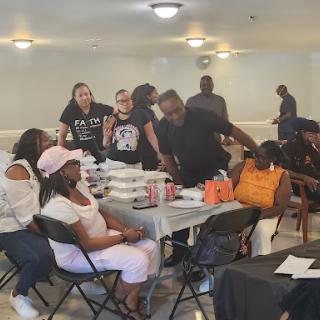 A lively community gathering with people engaging and enjoying their time together.