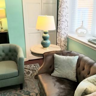 A cozy living room with stylish furniture and a soft color palette.