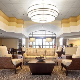 A modern hotel lobby with comfortable seating and stylish lighting.