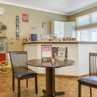 A cozy kitchen dining area with retro decor and vintage items.
