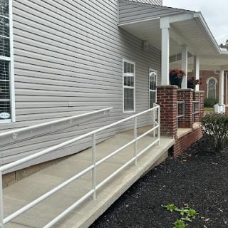 A wheelchair ramp providing accessible entry to a residential building.
