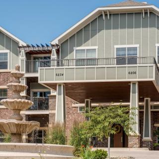 A modern residential apartment building with a distinctive architectural style.