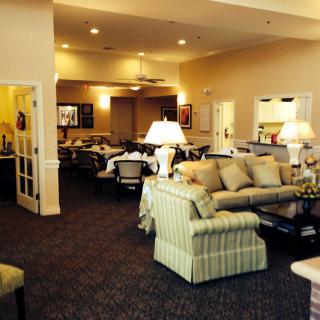 A cozy living room with comfortable sofas and soft lighting.