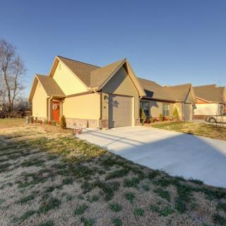 A suburban house with a driveway on a sunny day.