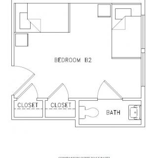 A floor plan showing a bedroom with closets and an attached bathroom.