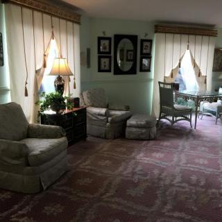 A cozy living room with comfortable seating and elegant decor.