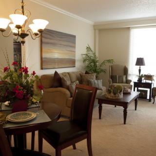 A cozy living and dining area with warm lighting and tasteful decor.