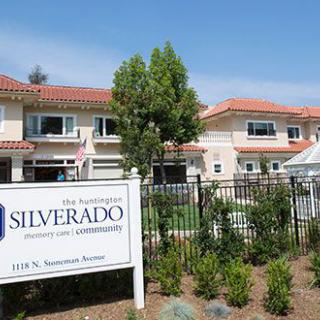 A residential building with a sign reading 'Silverado' and well-maintained gardens.