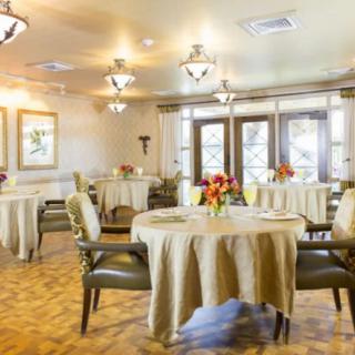 An elegant dining room with tastefully decorated tables and ambient lighting.