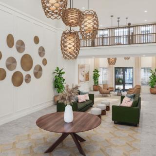 A modern lobby with stylish furniture and decorative lighting.
