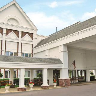 A hotel entrance with columns and decorative architecture.