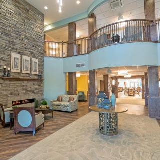 A spacious and elegantly decorated lobby with comfortable seating and modern architecture.