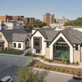 A modern architectural building set in an urban environment.