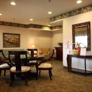 A cozy living room with elegant furniture and warm lighting.